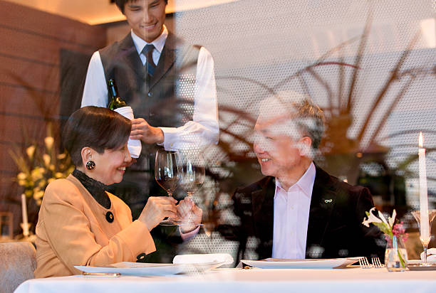 Happy mature couple dining at a restaurant Happy mature couple dining at a restaurant
