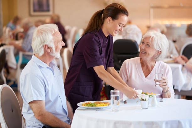 Senior Couple Being Served Senior Couple Being Served